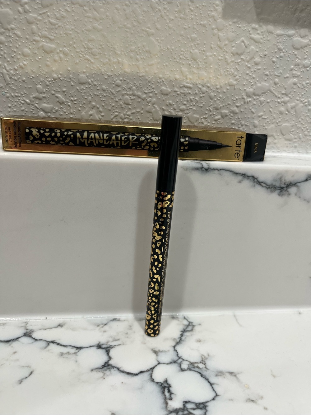 Tarte Maneater black eyeliner with gold leopard accents